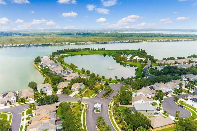 birds eye view of property with a residential view and a water view