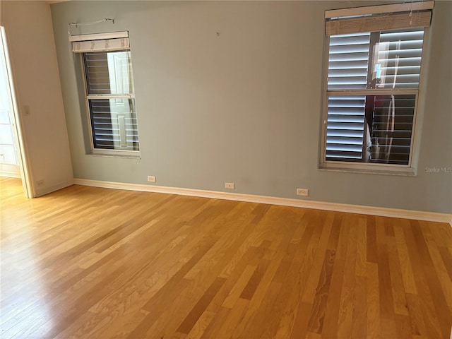 spare room with light hardwood / wood-style floors