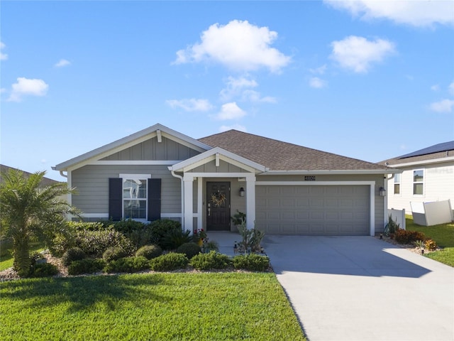 view of front facade featuring a garage and a front lawn