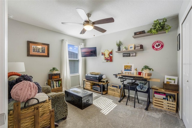 interior space with ceiling fan and carpet