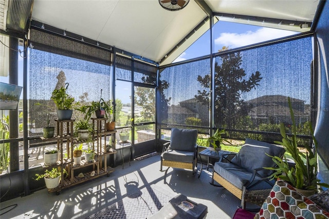 sunroom with vaulted ceiling and a healthy amount of sunlight