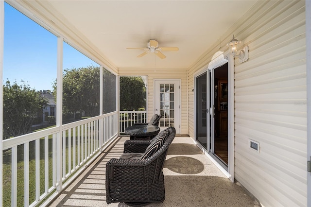 sunroom / solarium with ceiling fan