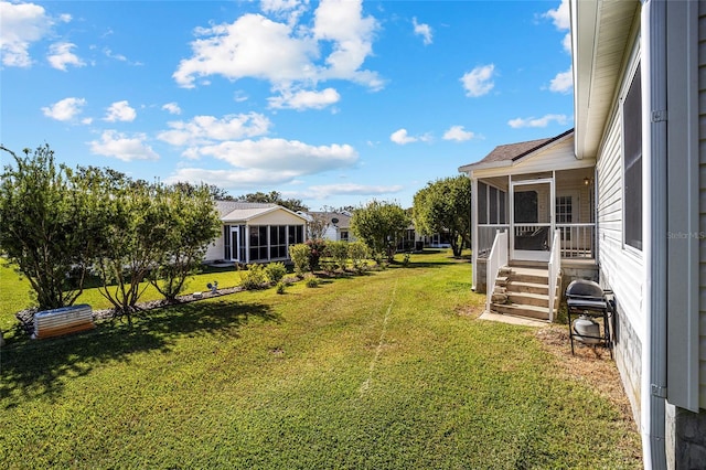 view of yard featuring a sunroom