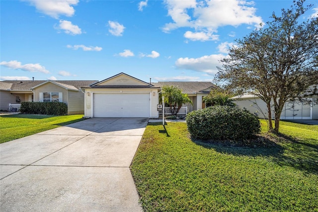 ranch-style home featuring a garage and a front lawn