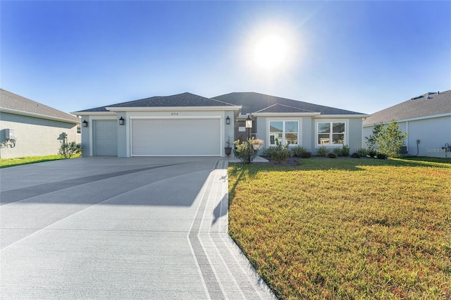 single story home with a front yard and a garage