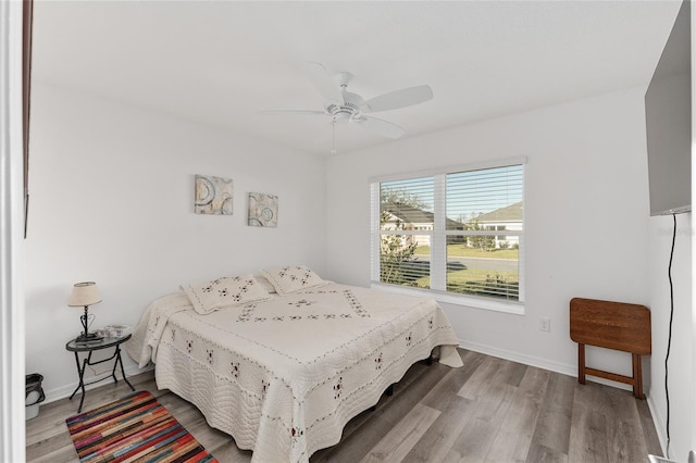 bedroom featuring ceiling fan and hardwood / wood-style flooring