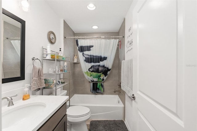 full bathroom featuring shower / tub combo, vanity, and toilet