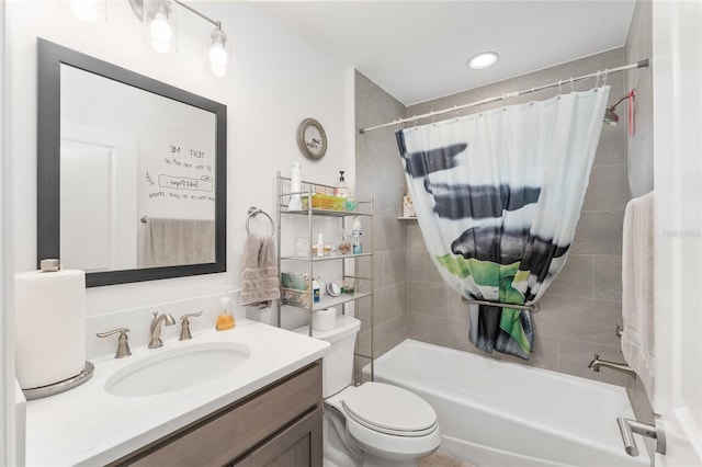 full bathroom featuring vanity, shower / bath combination with curtain, and toilet