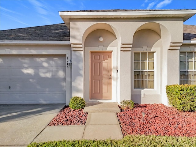 property entrance featuring a garage