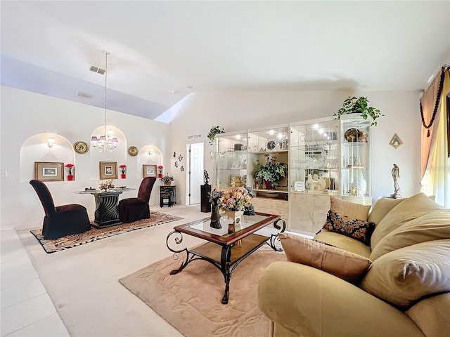 tiled living room with lofted ceiling and a notable chandelier