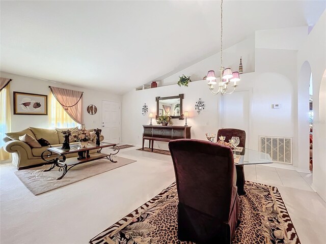 tiled dining space with high vaulted ceiling and an inviting chandelier