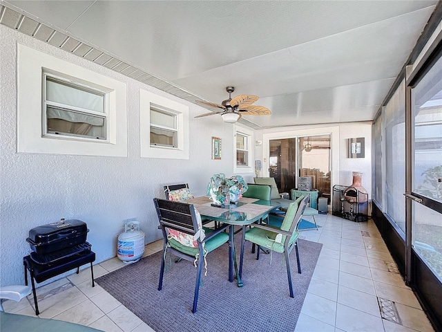 sunroom featuring ceiling fan