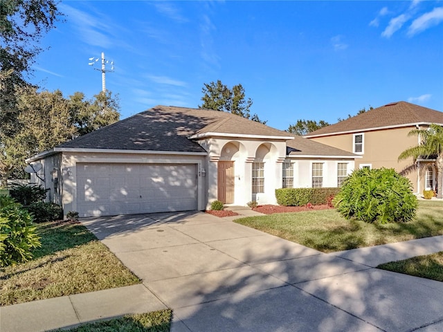 single story home with a front lawn and a garage