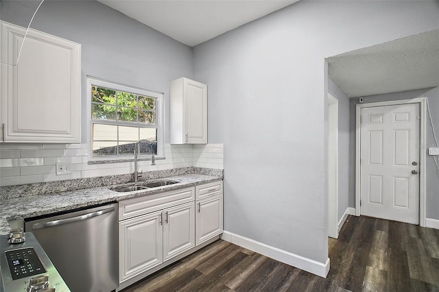 kitchen featuring dishwasher, dark hardwood / wood-style flooring, white cabinetry, and sink