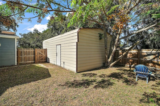 view of outbuilding with a lawn