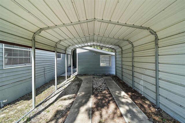 view of vehicle parking with a carport