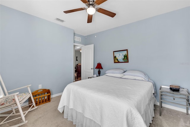 bedroom featuring ceiling fan and light carpet