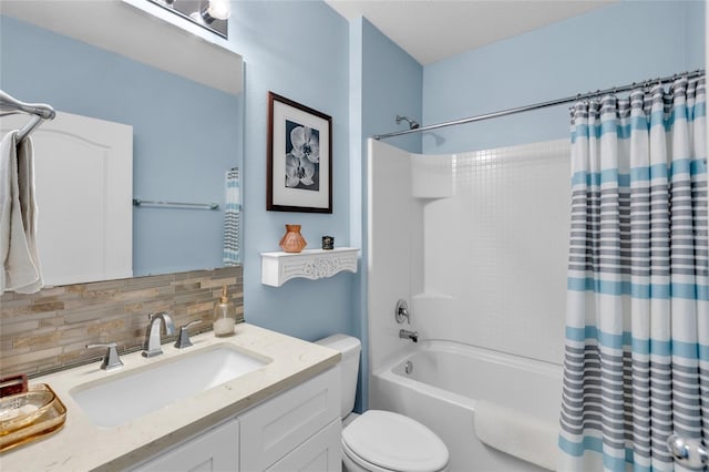 full bathroom featuring vanity, toilet, backsplash, and shower / tub combo