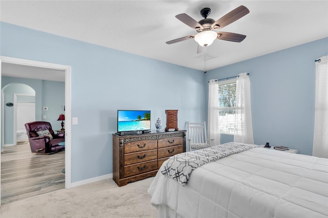 bedroom featuring light hardwood / wood-style floors and ceiling fan