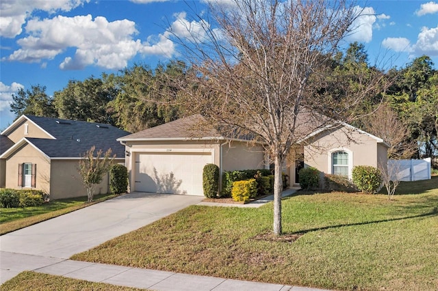 view of front facade with a garage and a front yard