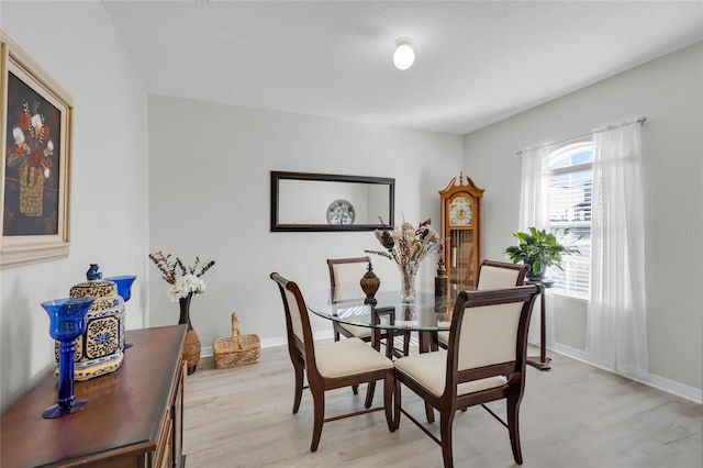 2354 Valhalla Dr, Tavares, FL 32778 - dining room featuring light wood-style flooring