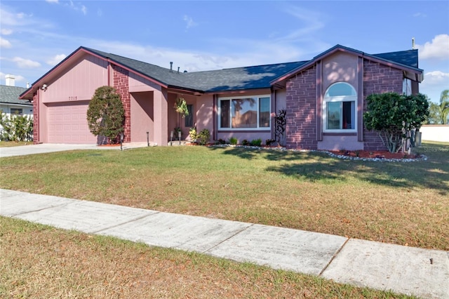 single story home with a front yard and a garage