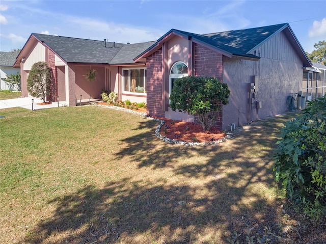 view of side of property featuring a lawn