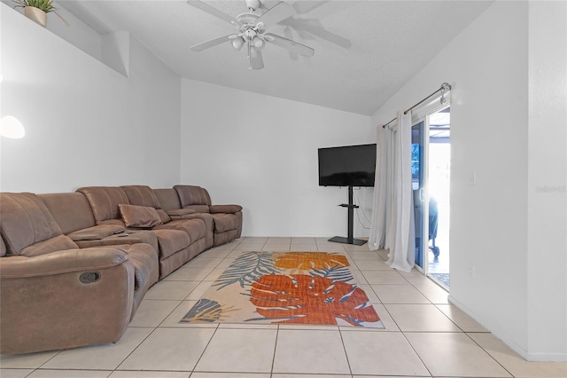 tiled living room featuring ceiling fan and lofted ceiling