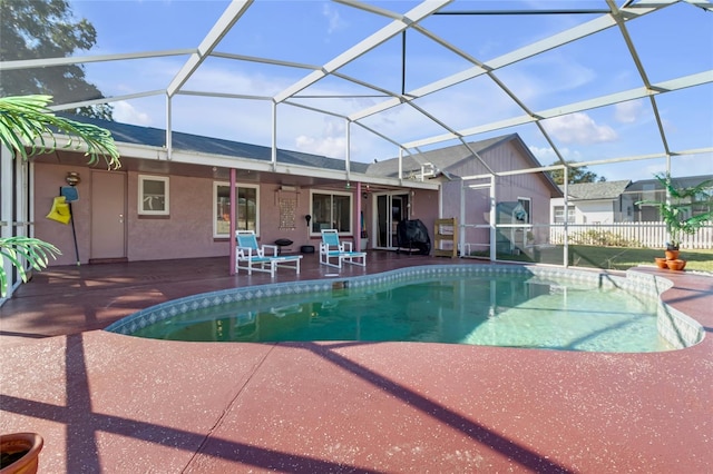 view of pool featuring a patio and a lanai