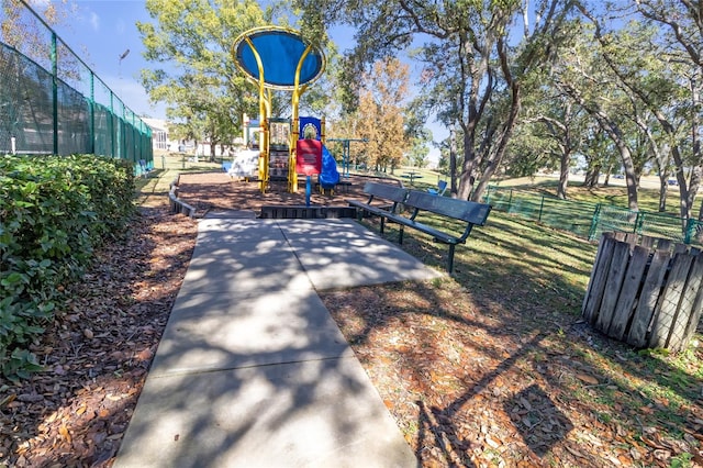 view of property's community with a playground