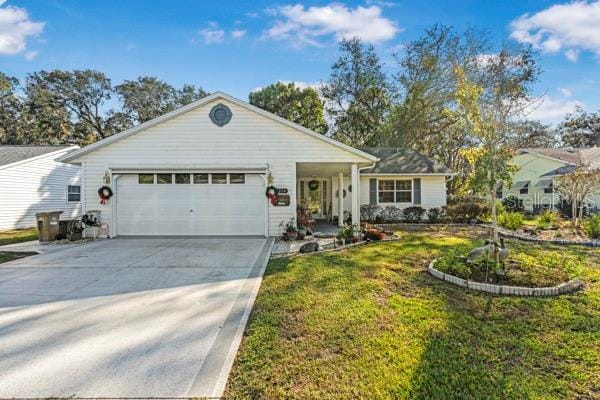 ranch-style house with a front yard and a garage