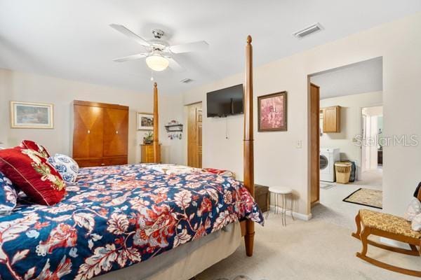 bedroom with washer / dryer, ceiling fan, and light carpet