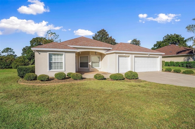 view of front facade featuring a garage and a front lawn