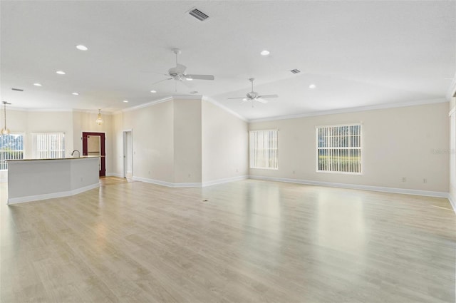 unfurnished living room with ceiling fan, crown molding, and light hardwood / wood-style flooring