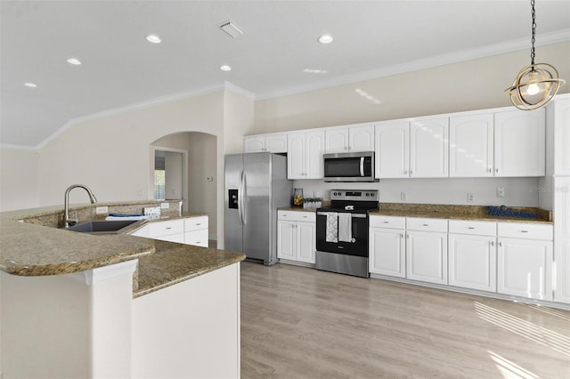 kitchen featuring appliances with stainless steel finishes, ornamental molding, pendant lighting, and sink