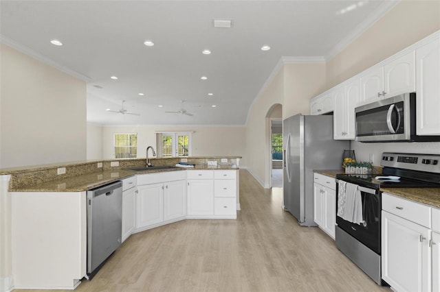 kitchen with ceiling fan, sink, white cabinets, and appliances with stainless steel finishes