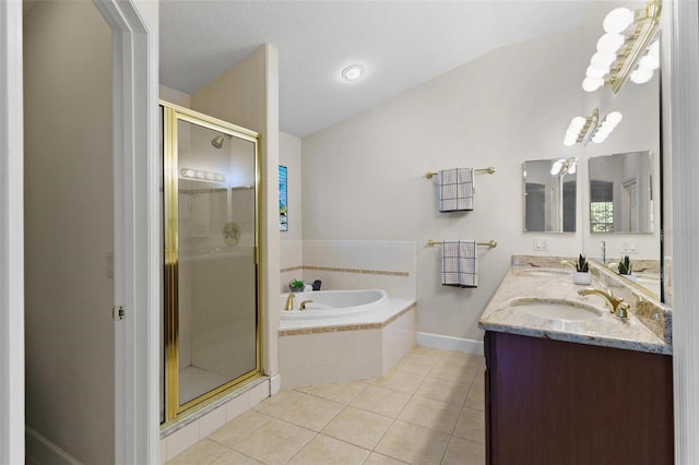 bathroom with tile patterned flooring, vanity, and plus walk in shower