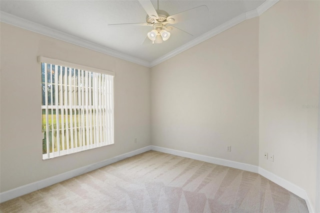 empty room with carpet floors, ceiling fan, and ornamental molding