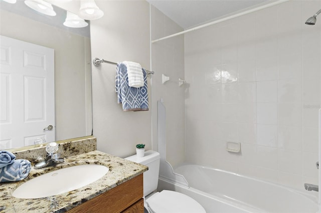 full bathroom featuring vanity, toilet, and tiled shower / bath combo