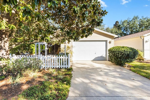 obstructed view of property featuring a garage