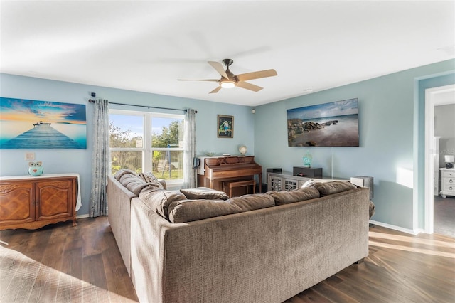 living room with ceiling fan and dark hardwood / wood-style flooring