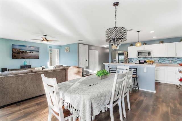 dining room featuring ceiling fan and dark hardwood / wood-style flooring