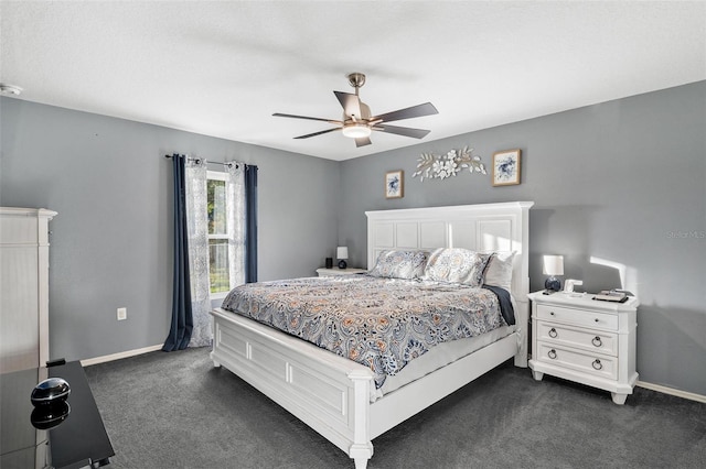 bedroom with dark colored carpet and ceiling fan