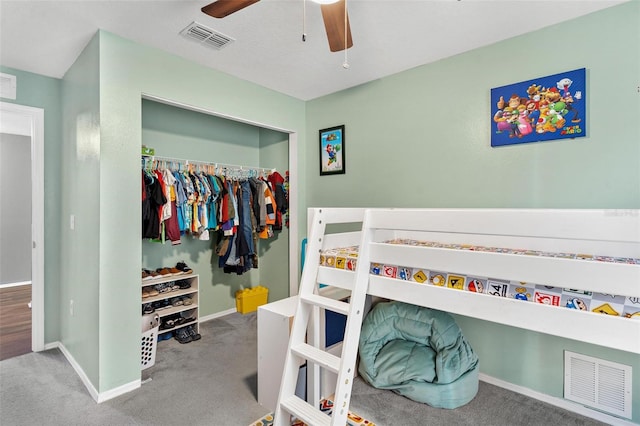 bedroom featuring ceiling fan, a closet, and carpet