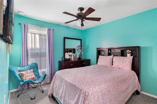 bedroom featuring ceiling fan and light colored carpet