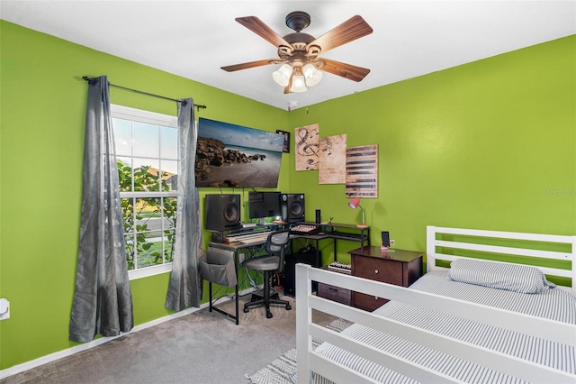 bedroom with ceiling fan and light carpet