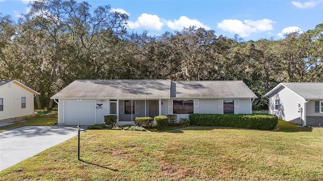 ranch-style home with a garage and a front lawn