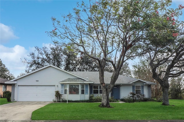 ranch-style home featuring a front yard and a garage