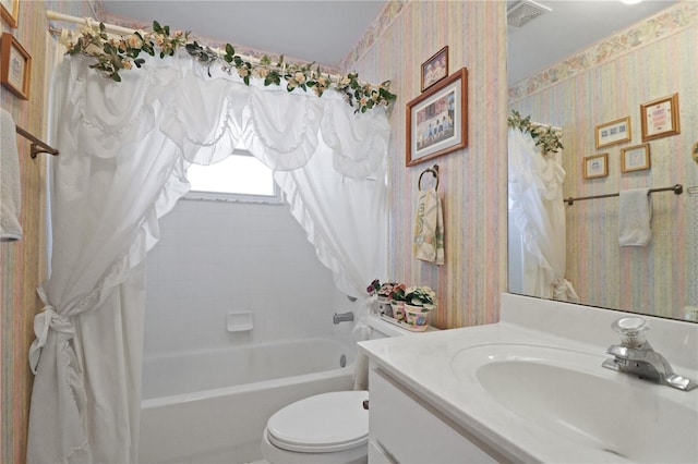 full bathroom featuring vanity, shower / bath combo, and toilet