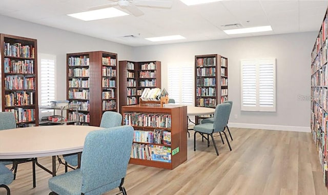 office area with ceiling fan, plenty of natural light, and light wood-type flooring